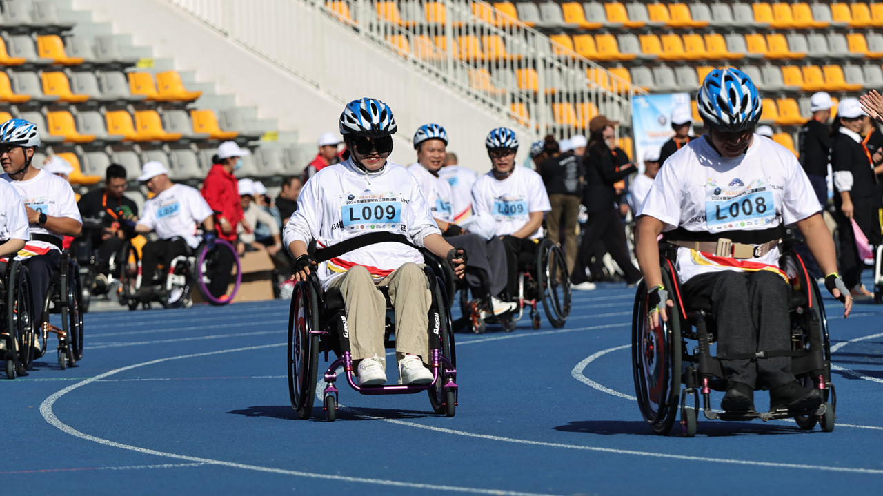 Wheelchair triathlon challenge celebrates Intl. Day of Persons with Disabilities,longhua,longhua district,Longhua Government Online