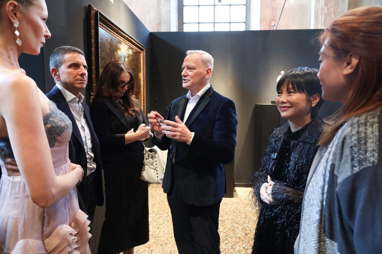 Giacomo Santucci (2nd R), the former president and CEO of Gucci and the chief curator of the lifestyle week, gives a guided tour to the guests at the opening ceremony of the event April 9..jpg